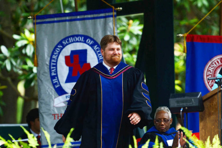 Weber on the way to the podium at graduation.