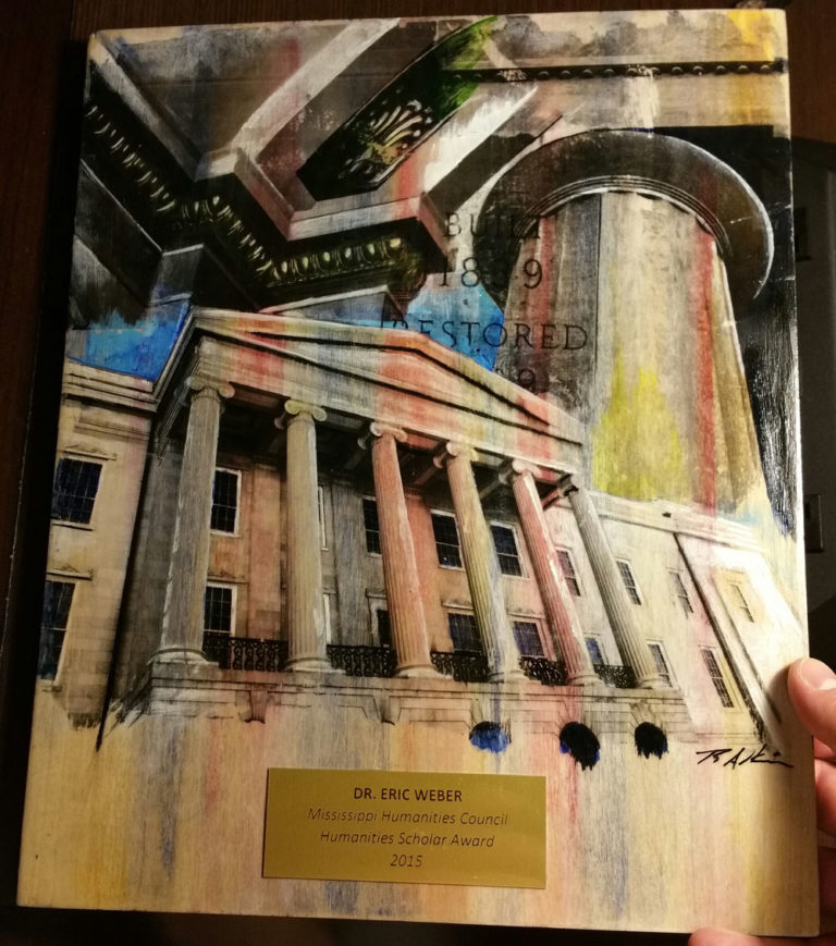 The artwork that the Mississippi Humanities Council commissioned to serve as an award plaque for the 2015 Humanities Scholar Award I received. The artwork depict Jackson, Mississippi's Old Capitol building.