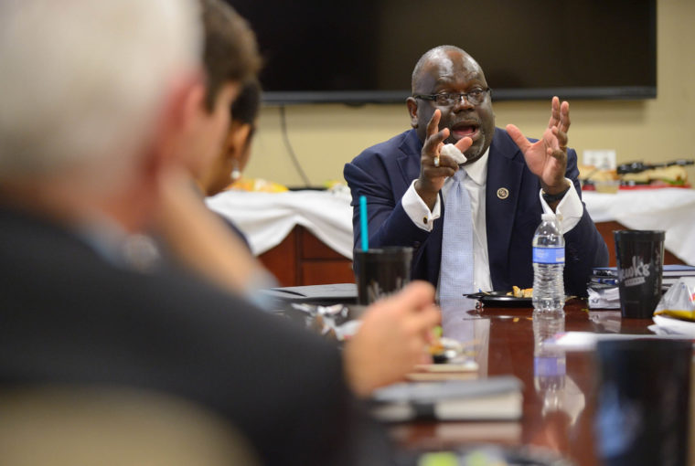 U.S. District Judge Carlton Reeves, in October 2015, talking with students at lunch.