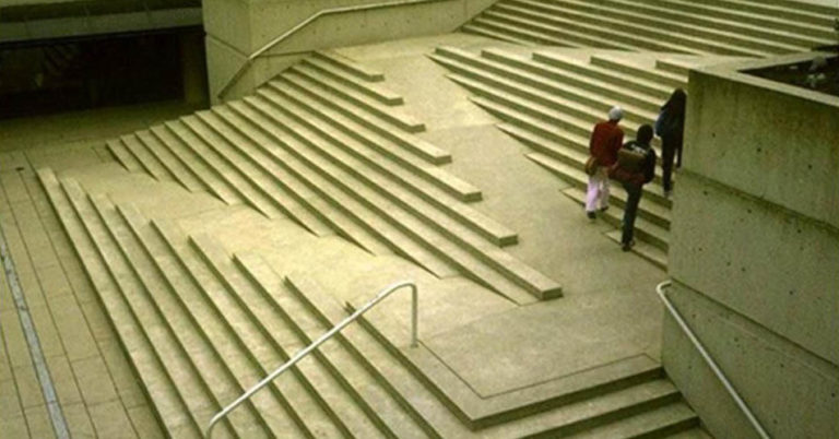 Major stairs designed to be accessible, with a slow, flat-sloped zig zag that is accessible running across the width of the stairs on up.