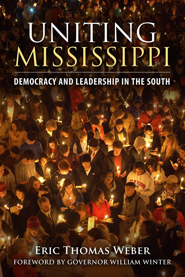 Cover of Uniting Mississippi, featuring a crowd of students participating in the University of Mississippi's unity march. 